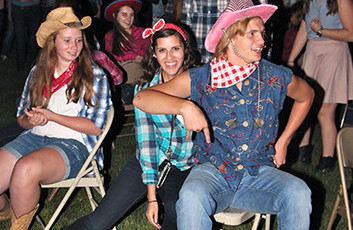 John Klauer, 14, battles Lana Kaczmarek, 15, for a seat during Musical Chairs at the Hoedown while Caroline White, 17, basks in the fact that she definitely has a chair.