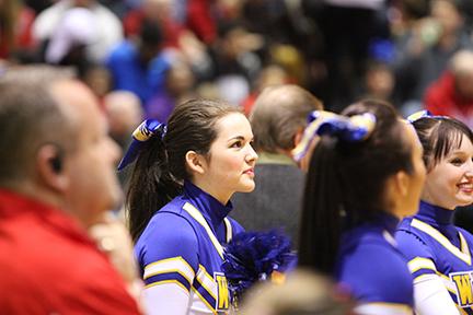 Anna Sulentic, 17, carefully watches the Wahlert-Senior basketball game at the Nora Gymnasium. This is Sulentics first season cheering for the basketball team.