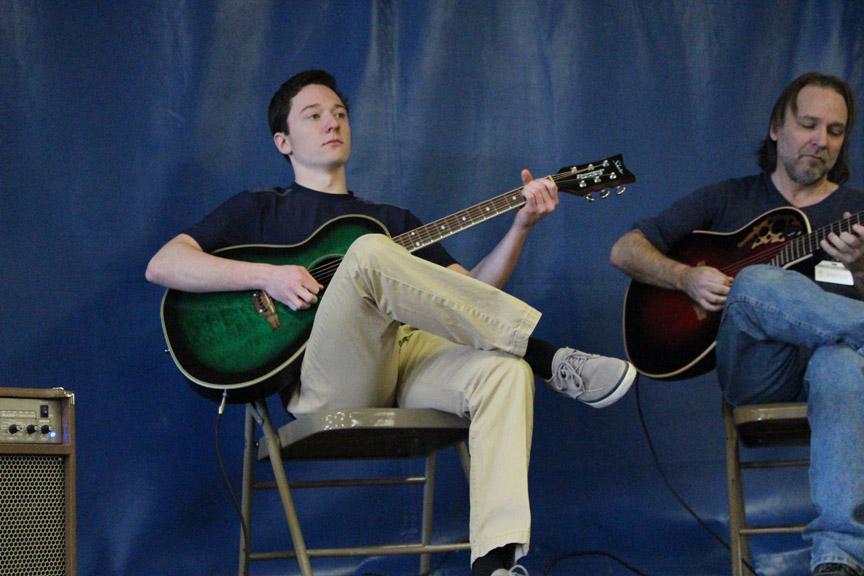 John Ott, 15, plays his guitar with his instructor to kick off Wahlerts first talent show on January 30, 2015. 