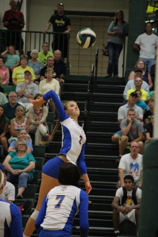 Mackenzie May, '17, goes up for a spike against Hempstead. 