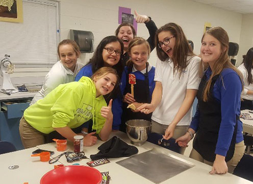 Hannah Scheisl, Jessica Perez, Alaina Schmidt, Christine Kalb, Libby Wedewer, 20, Adrianna Schroeder, 18, and Avery Fair, 20, helped bake cookies for the open house for the incoming freshmen of the 2018-2019 school year.