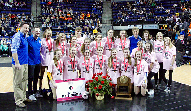 The volleyball team poses for their State Championship picture. 