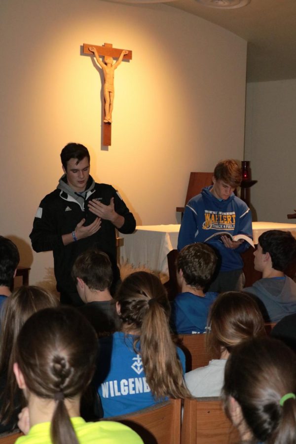 Joe Friend and Zach Kemp, 18, lead the discussion for FCA in the chapel. 