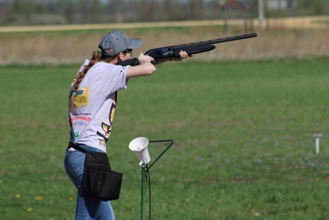 Emily Kasal, '20, shoots at a clay pigeon target at her meet in DeWitt, Iowa.