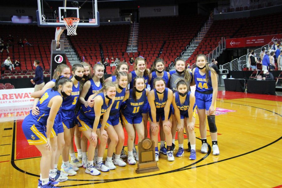 STATE WORTHY
The team poses with its state participant trophy at the Wells Fargo Arena in Des Moines. They returned to state for the first time since 2013.