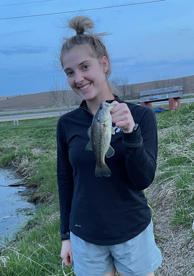 FISHIN AND LOVIN 
Maria Roth 21, on her first fishing adventure of the year.