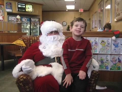 SANTA, BABY
Joe Mai, 23, sits on Santas lap as a child