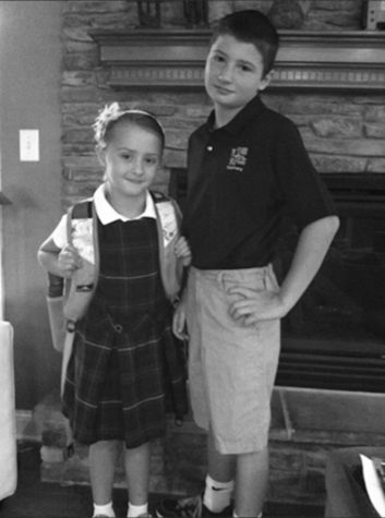 BLAIR WALDORF CHIC

Anna Dehn, 24, poses with Connor Dehn, 20, in her plaid skirt for the first day of school. 